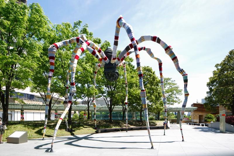 Louise Bourgeois’s 1999 bronze sculpture Maman wrapped in fabric by Magda Sayeg in a temporary installation at Roppongi Hills, Tokyo